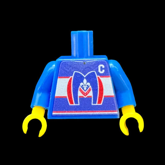 Blue Lego-like torso piece with yellow limbs on a dark background. Custom print featuring Montreal Metros from Heated Rivalry. 